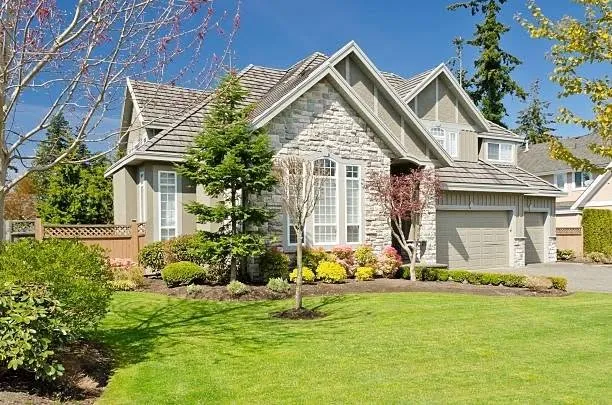 Home in Lapeer, Michigan with a lush green lawn
